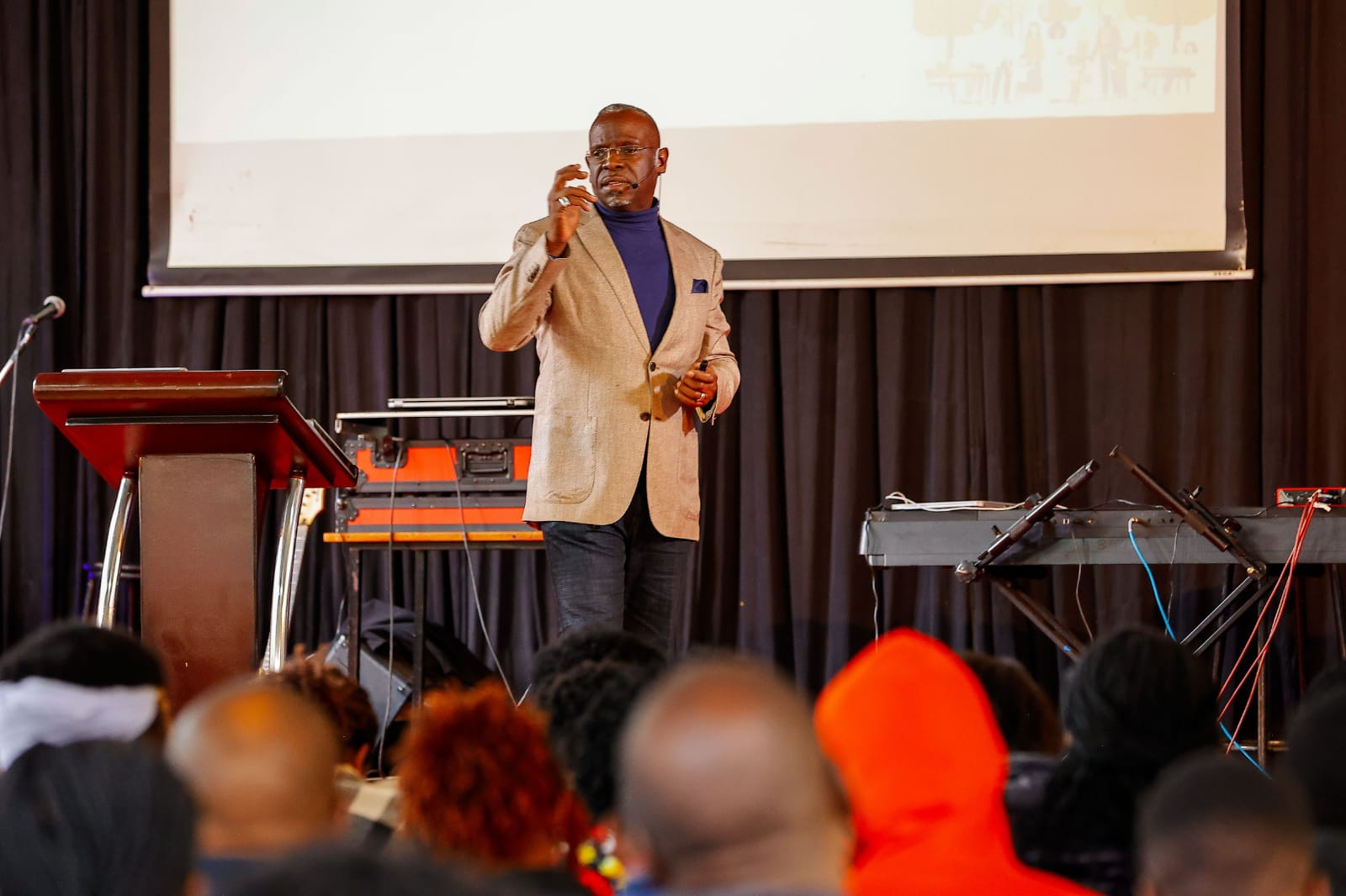 Sir John speaking on stage
